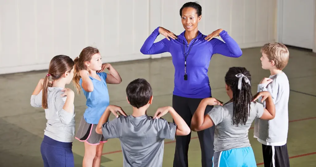 "Career in Sports Education – Physical education teacher guiding students during a sports training session in school."
